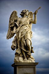 Bernini's marble statue of angel with cross from the Sant'Angelo Bridge in Rome, Italy