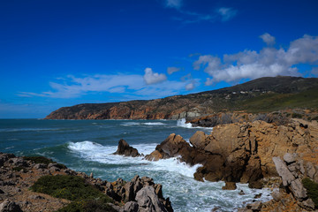 Portuguese coastline with the ocean and the sintra mountains in background. Cascais Portugal