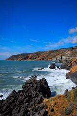 Portuguese coastline with the ocean and the sintra mountains in background. Cascais Portugal