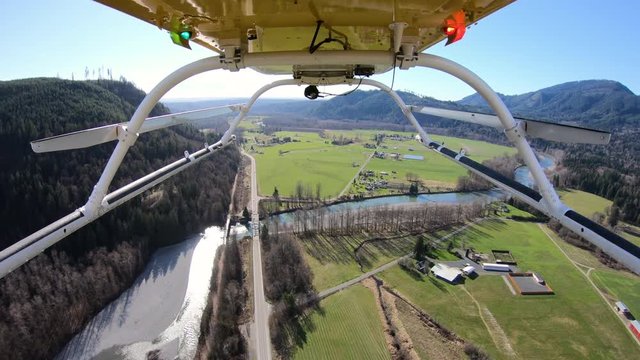 Helicopter Traveling Above Farm Fields Aerial View Rural Western Washington Valley River Bridge Crossing Stillaguamish