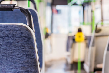 Interior of the bus. Seat places in front side of bus with turnstile