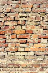 Vertical background of old vintage red brick wall