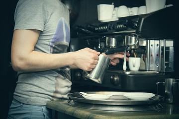 waiter preparing coffee at the bar
