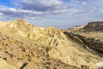 Fototapeta na wymiar Clouds over a rocky valley in the Negev desert