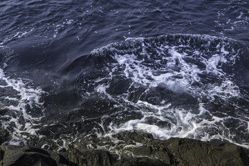 waves splashing on rocks