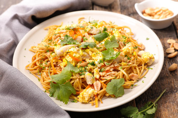 fried noodles with egg, vegetable and almond