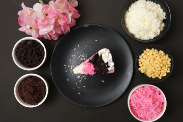 Strawberry milk cake on black background