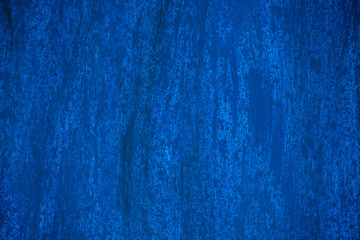 Dark blue and blue background smeared with brushes.