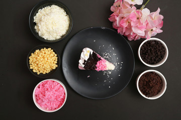 Strawberry milk cake on black background