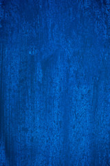 Dark blue and blue background smeared with brushes.