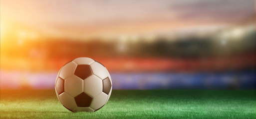 Fototapeta na wymiar Football ball on the field of a world cup stadium - 3d rendering