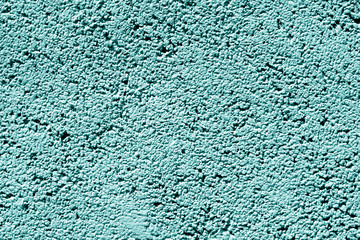 Cement wall texture in cyan tone.
