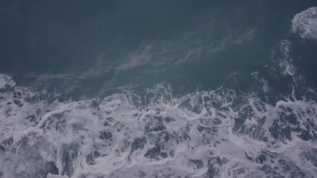 Sea foam and droplets break out from under the ship. slow motion. 1920x1080. full hd