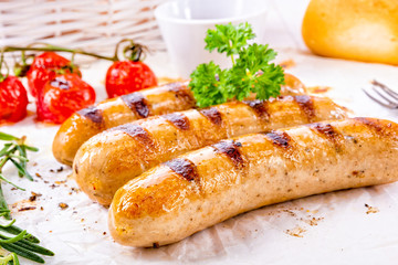 delicious bratwurst with ketchup and fresh rolls
