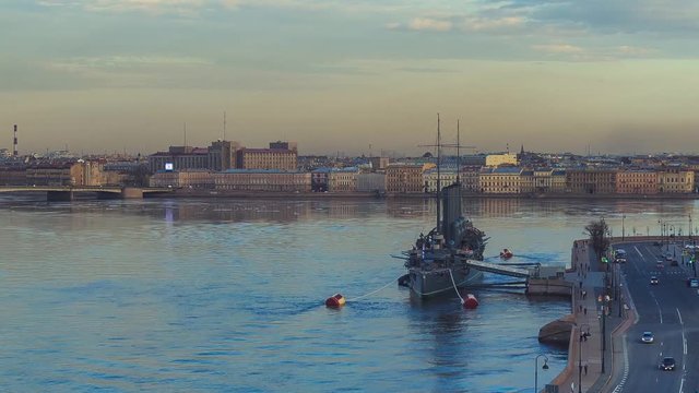 view of the cruiser Aurora and the Neva in St. Petersburg in the evening in the spring. Timelapse