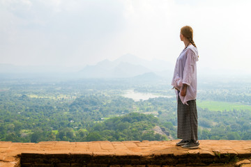 Naklejka na ściany i meble Beautiful girl on the mountain Sigiriya, Sri Lanka