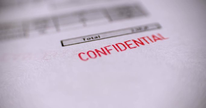 'CONFIDENTIAL' Red Stamp over a white background.