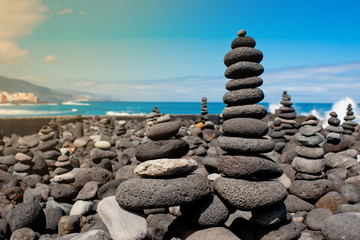 Stack of stones on the sea beach. Tenerife.