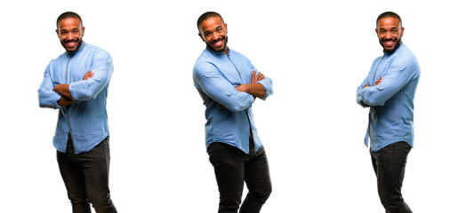 African american man with beard with crossed arms confident and happy with a big natural smile laughing