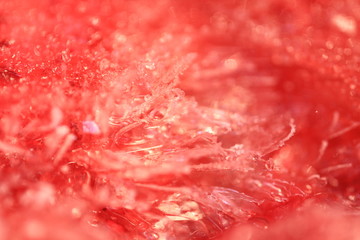 abstract red background blur color for design, line pattern, shiny texture of crystal ice with sparkle, wallpaper frosted snow close up