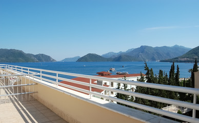View of the blue sea and mountains from the balcony of hotel.