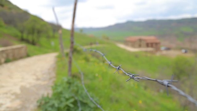 Fence with barbed wire