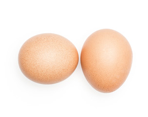 Brown chicken eggs top view isolated on white background two domestic.