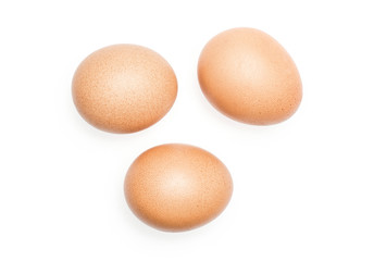 Brown chicken eggs top view isolated on white background three domestic.
