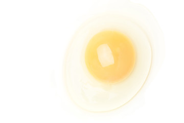 One raw chicken yolk isolated on white background top view.