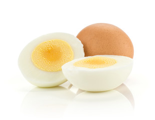 One brown chicken egg and two boiled sliced halves isolated on white background.