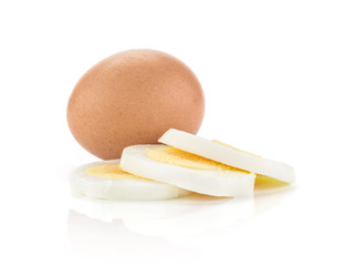 One boiled brown chicken egg and three slices isolated on white background.