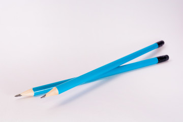 Two blue Pencils on white background. stationery. Office tool. Back to school.