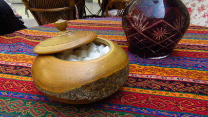 Sugar on Table With Turkish Tapestry Tablecloth
