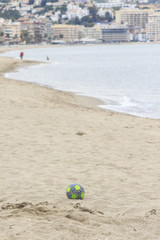 Soccer ball on the beach