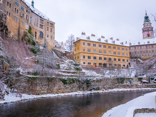 Historical houses and castle landmark  statue river winter season snow in Cesky Krumlov. Czech Republic