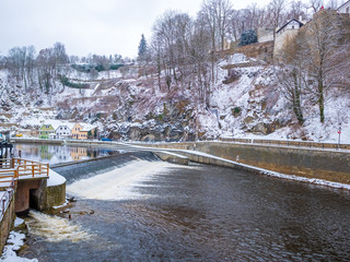 Historical houses and castle landmark  statue river winter season snow in Cesky Krumlov. Czech Republic