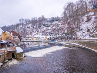 Historical houses and castle landmark  statue river winter season snow in Cesky Krumlov. Czech Republic