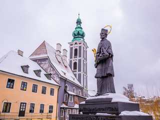 Fototapeta premium Historical houses and castle landmark statue river winter season snow in Cesky Krumlov. Czech Republic
