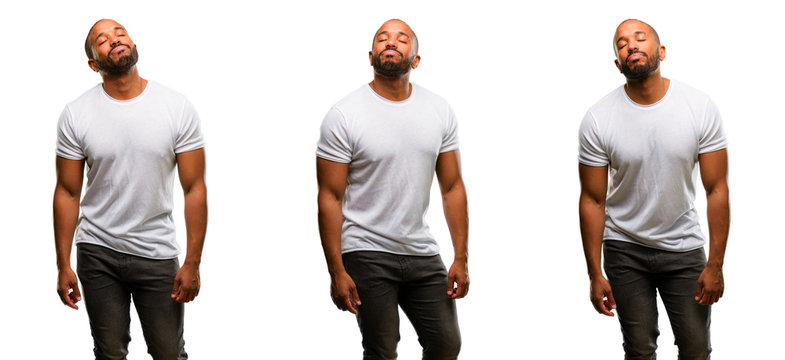 African american man with beard with sleepy expression, being overworked and tired