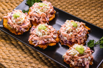 Fried plantain with salad and sauces