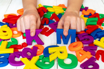 Child learning using magnetic numbers and letters
