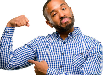 African american man with beard pointing biceps expressing strength and gym concept, healthy life its good isolated over white background