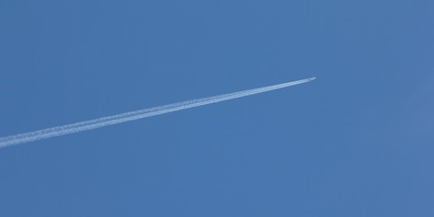 Plane on blue sky, background air transport.