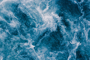 Abstract blue sea waves with white foam  for background, natural summer background, pattern concept