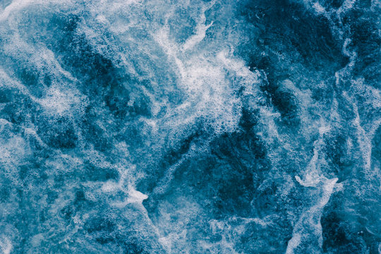 Abstract blue sea waves with white foam  for background, natural summer background, pattern concept