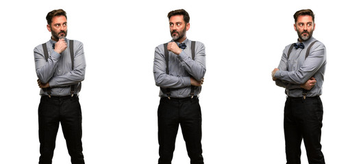 Middle age man, with beard and bow tie doubt expression, confuse and wonder concept, uncertain...