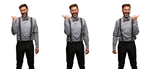 Obraz premium Middle age man, with beard and bow tie pointing away side with his finger