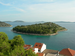 Fototapeta na wymiar A small green islet, Croatia, around Tribunij