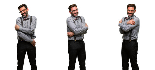 Middle age man, with beard and bow tie confident and happy with a big natural smile laughing, natural expression