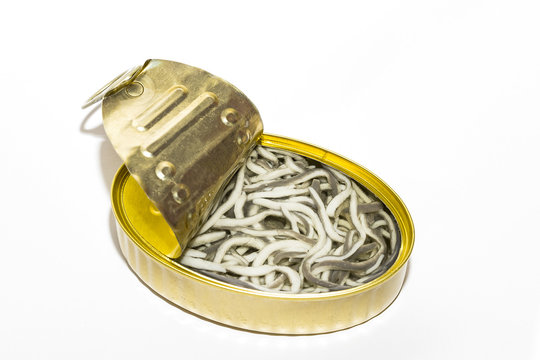 Open can with canned seafood close-up on a white background